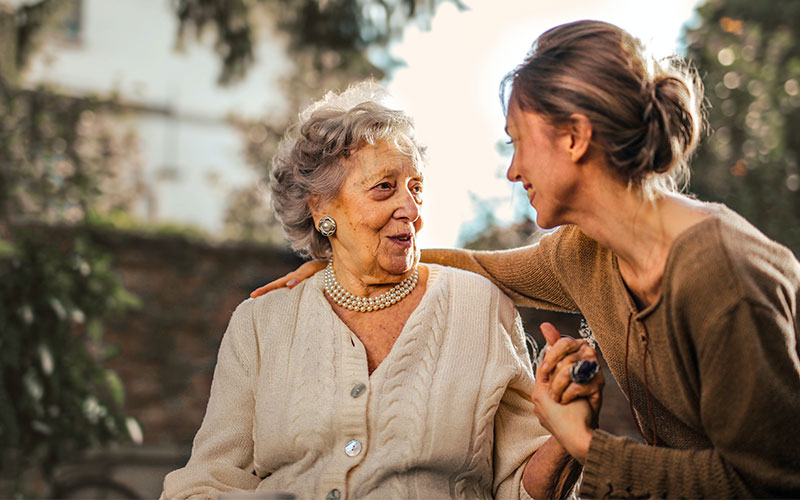 woman assist elderly