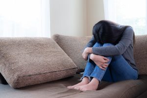 emotional young woman was depressed sofa