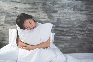young woman is depressed white bed
