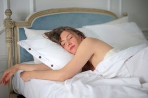 young female sleeping peacefully bed morning